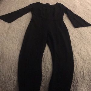 One piece black Ali and Jay pant suit